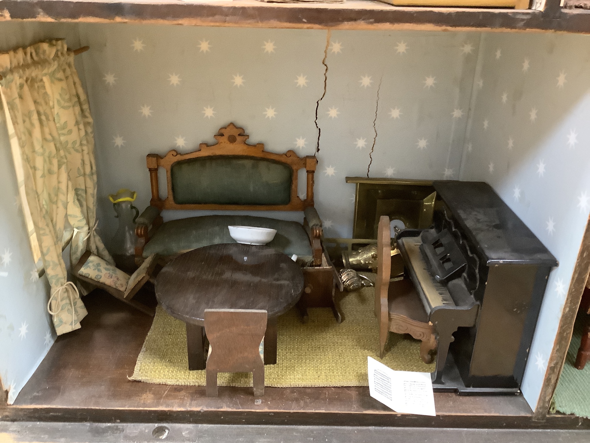 A furnished English dolls’ house, circa 1810-20, 104cm high